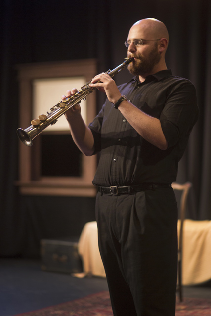 Jake Sorgen performs on saxophone in the music preshow